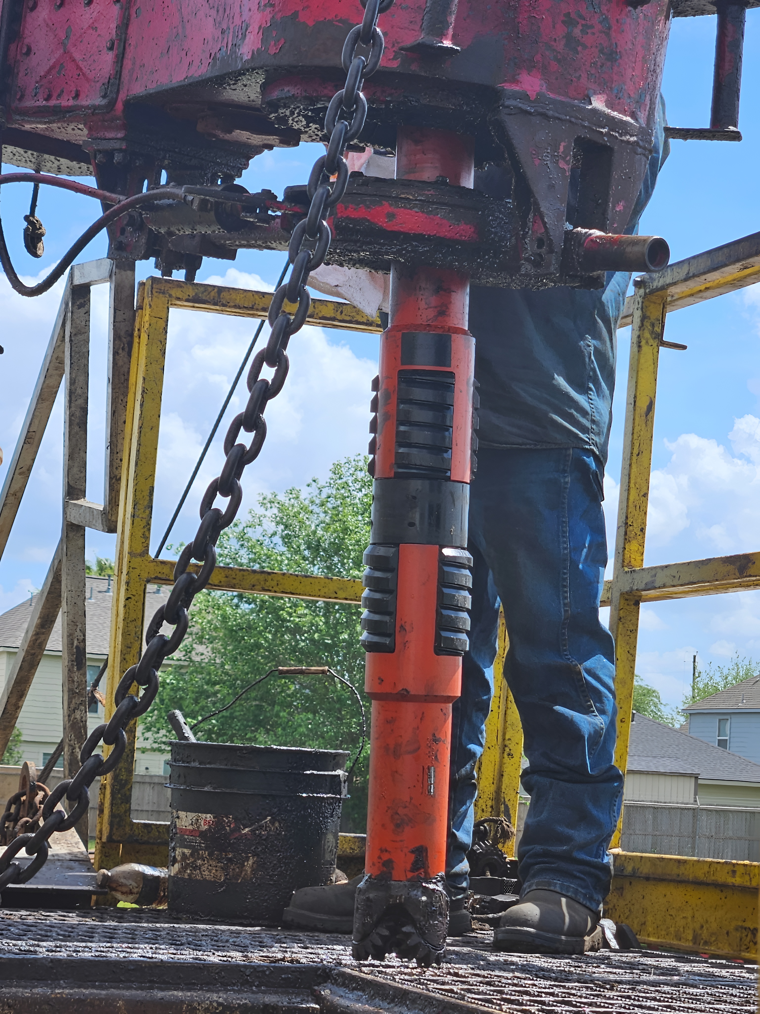 Casing scraper tool being run on drilling rig